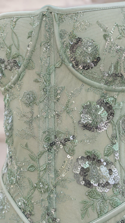 Close-up detail of floral embroidery and sequin embellishments on Sage Green bodice