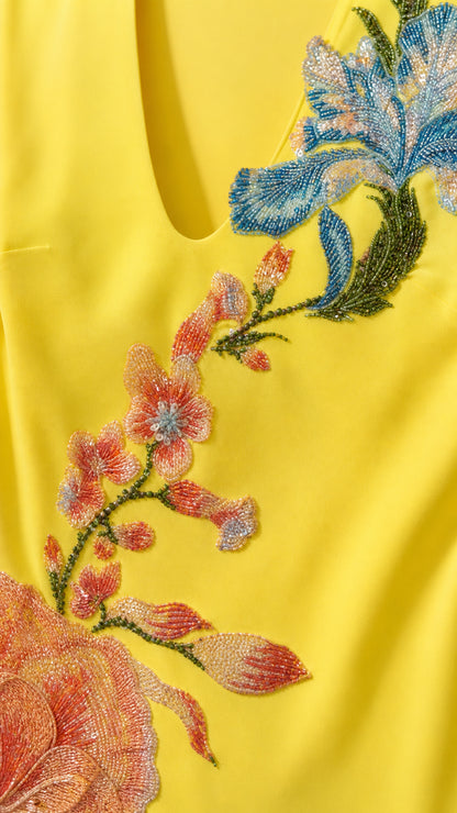 Close-up detail of floral embroidery and beadwork
