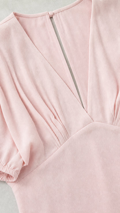 Close-up of neckline, gathering, and fabric texture