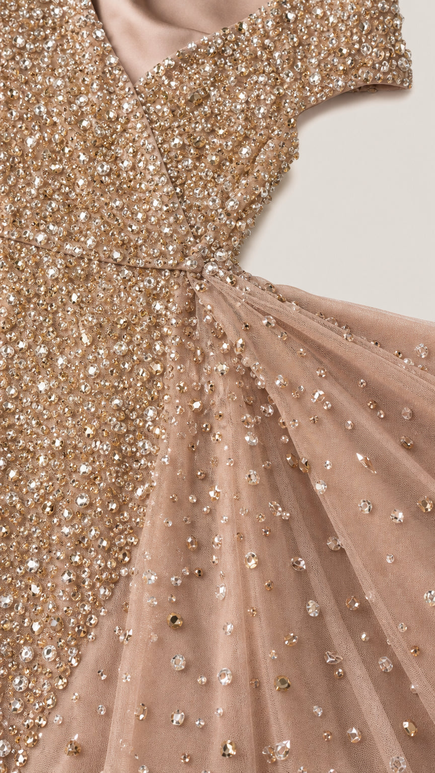 Close-up detail of shimmering sequin and bead embellishment on tulle fabric