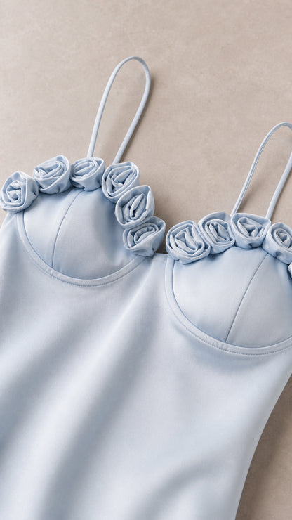 Close-up of 3D rose appliqués on sweetheart neckline