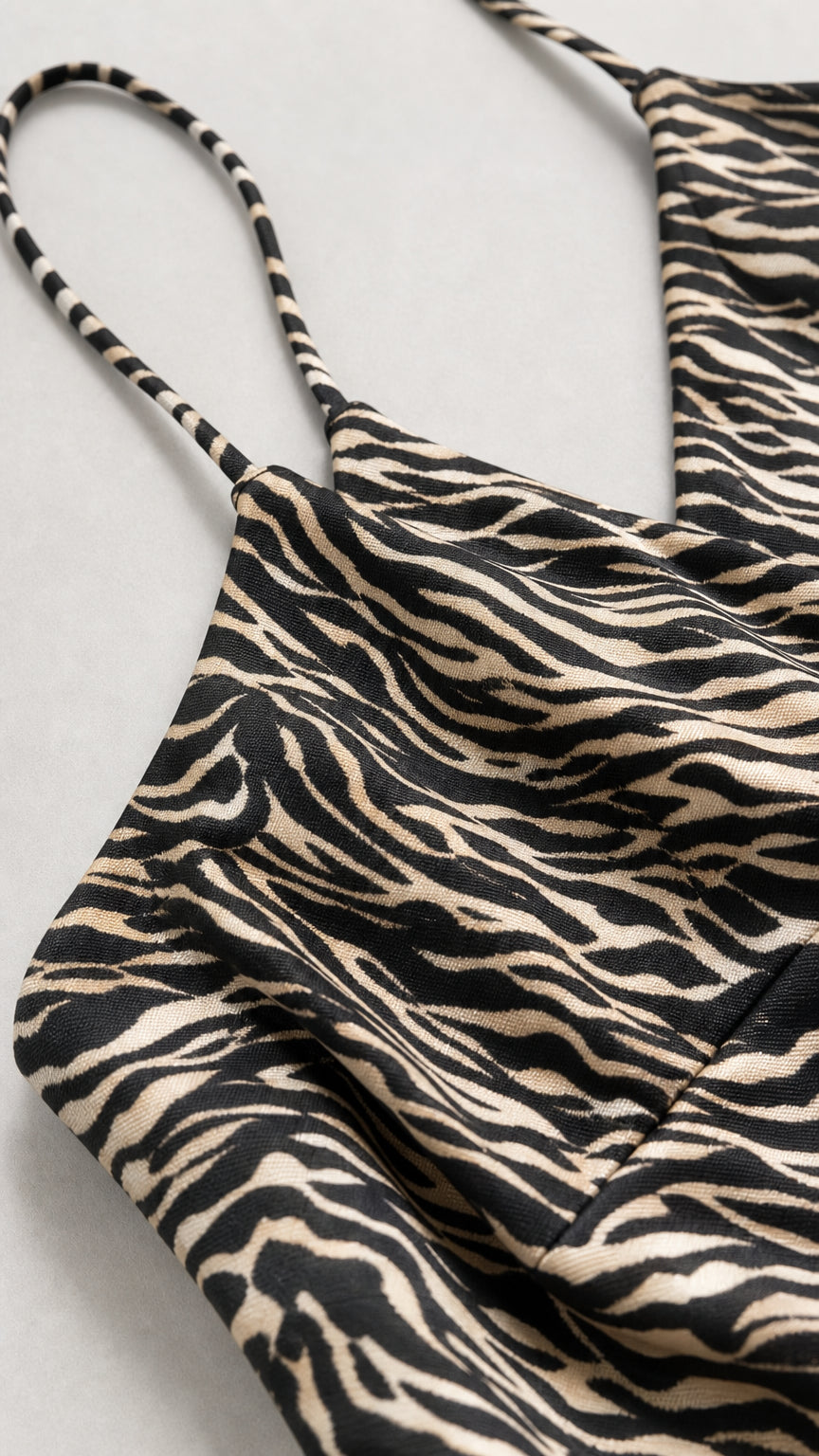 Close-up detail of fabric texture and spaghetti straps