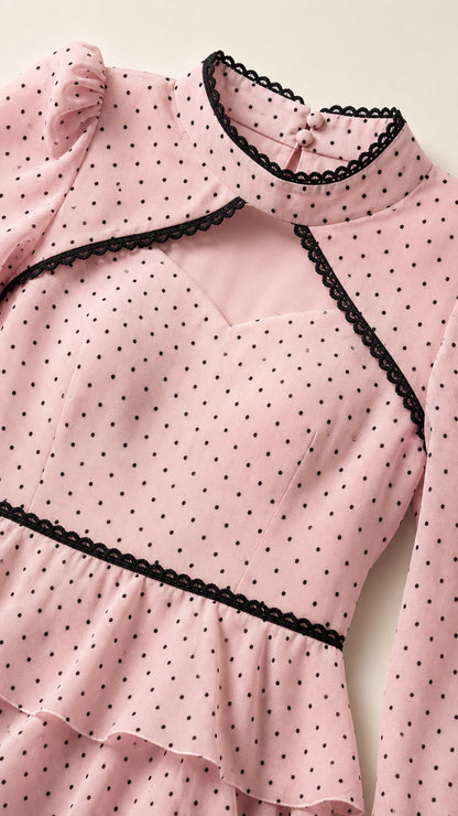 Close-up of blush pink dress bodice with lace trim and sweetheart cutout detail