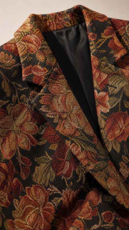 Close-up detail of the textured floral jacquard fabric and lapel construction
