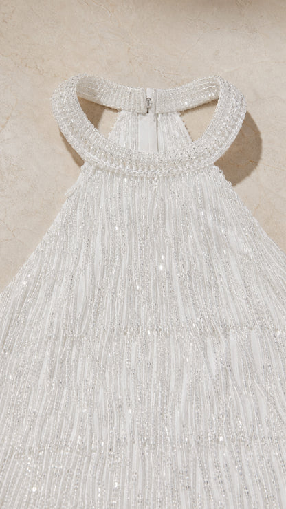 Close-up of beaded halter neckline and fringe texture