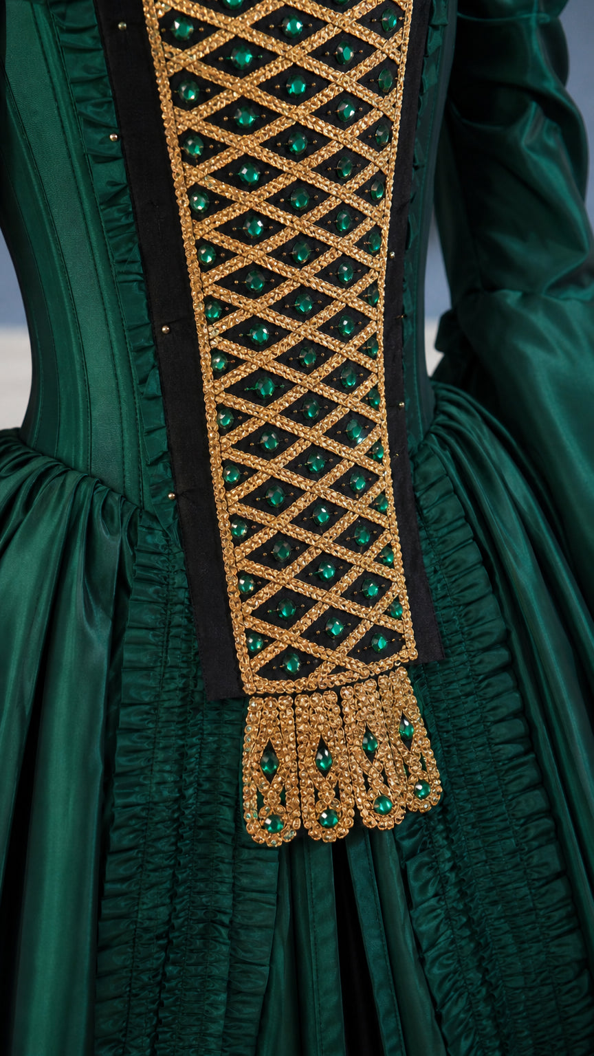 Close-up of gold lattice bodice detail on green ball gown