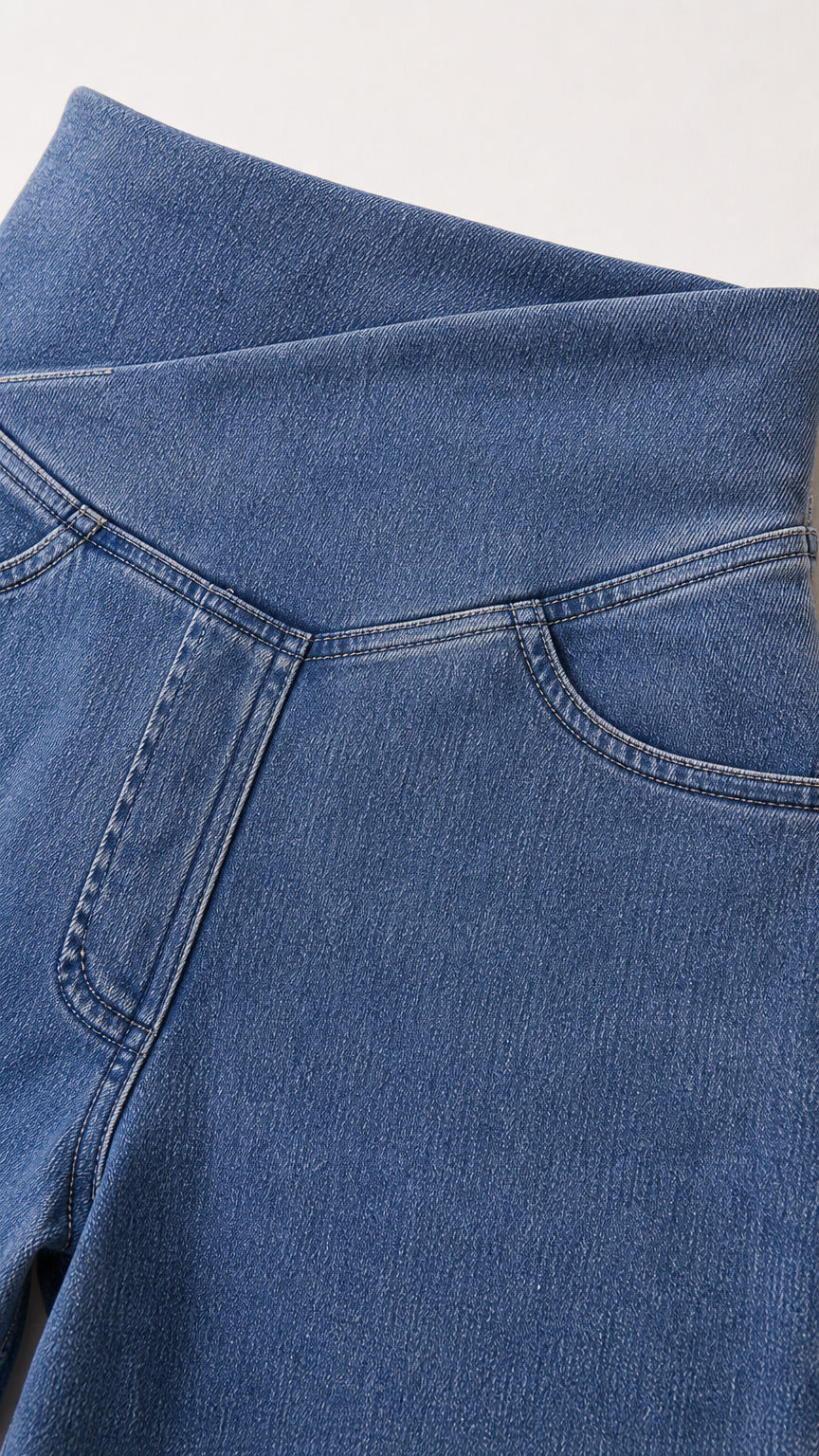 Close-up of the crossover high-waisted denim detail