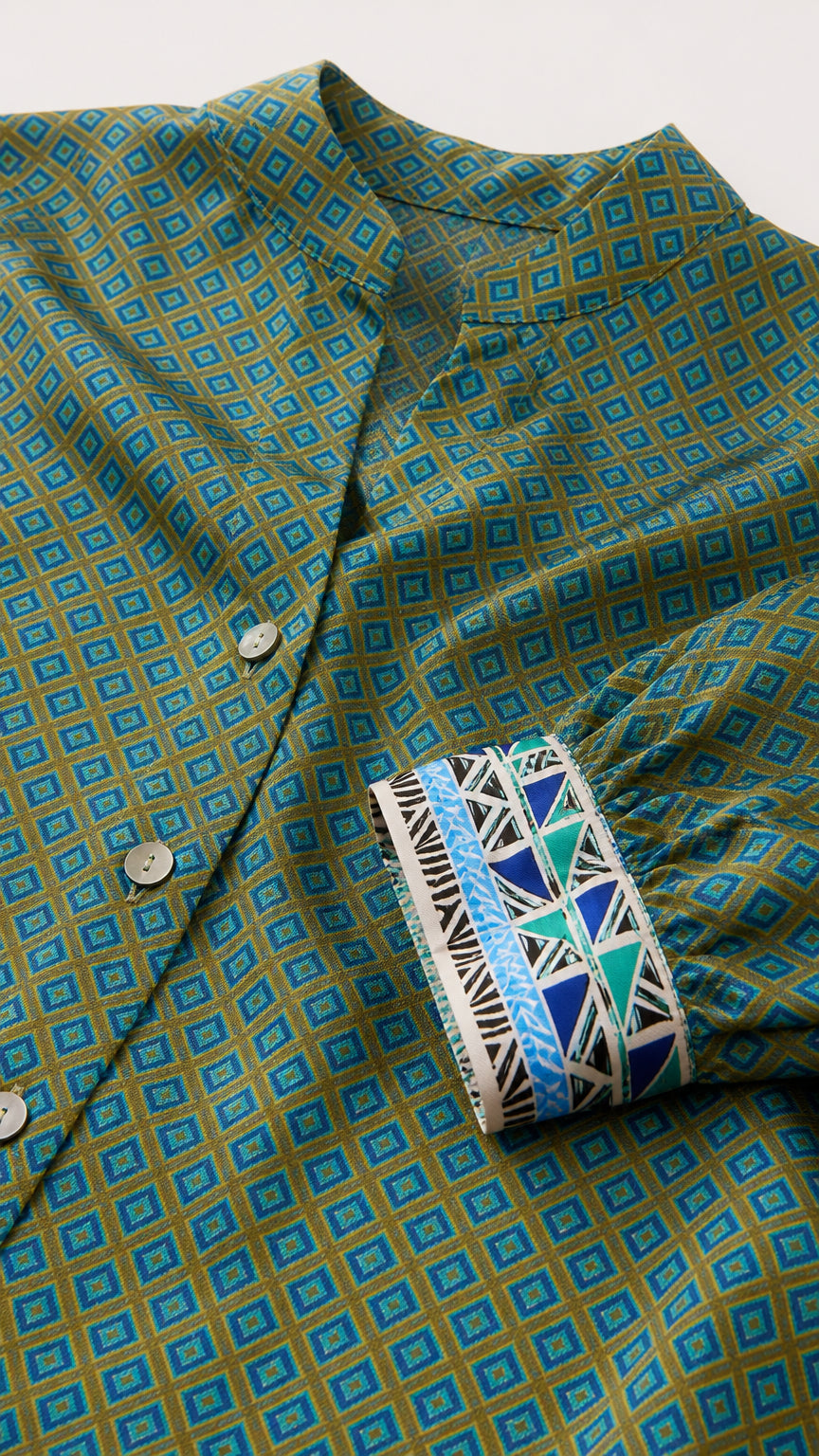 Close-up of geometric pattern and contrasted patterned cuffs
