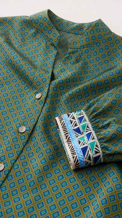 Close-up of geometric pattern and contrasted patterned cuffs