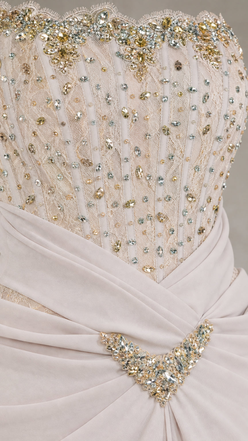 Close-up detail of rhinestone beaded corset bodice and ruched waist brooch accent