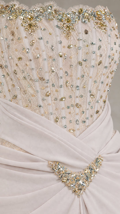 Close-up detail of rhinestone beaded corset bodice and ruched waist brooch accent