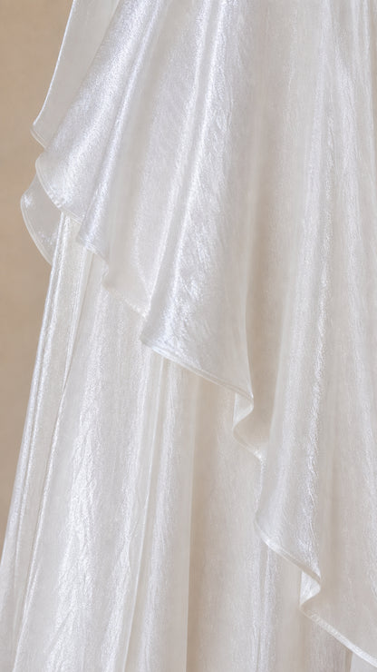 Close-up detail of shimmering tiered ruffle fabric