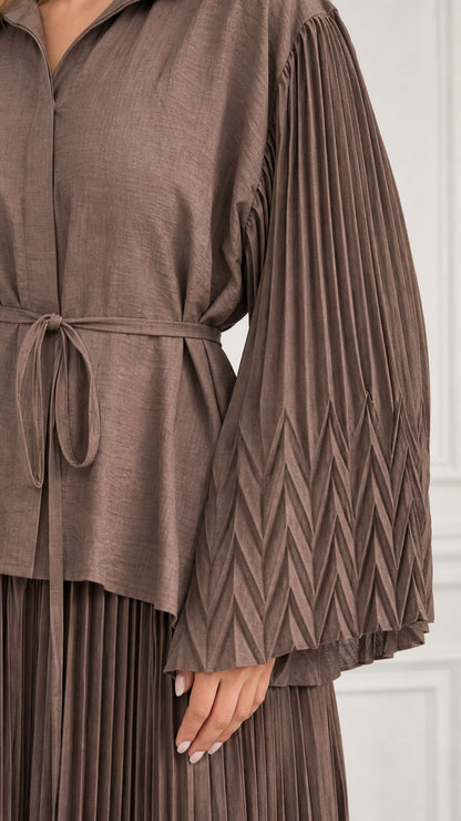 Close-up detail of Mocha Brown chevron-pleated sleeve and waist tie belt