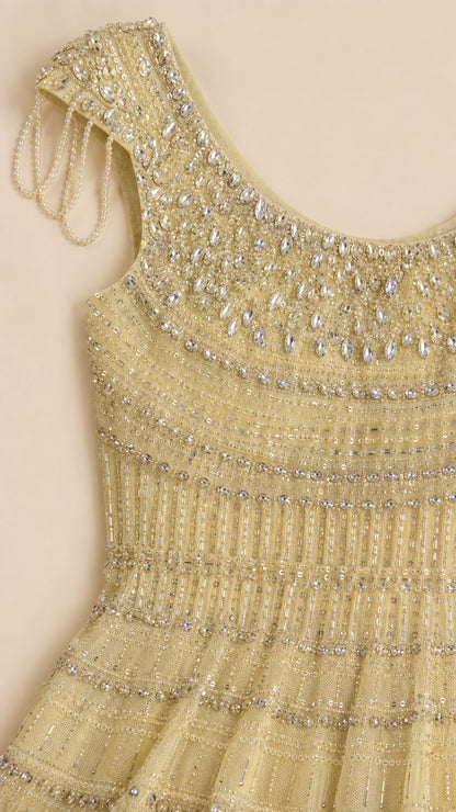 Close-up of crystal and bead embellished bodice on yellow gown