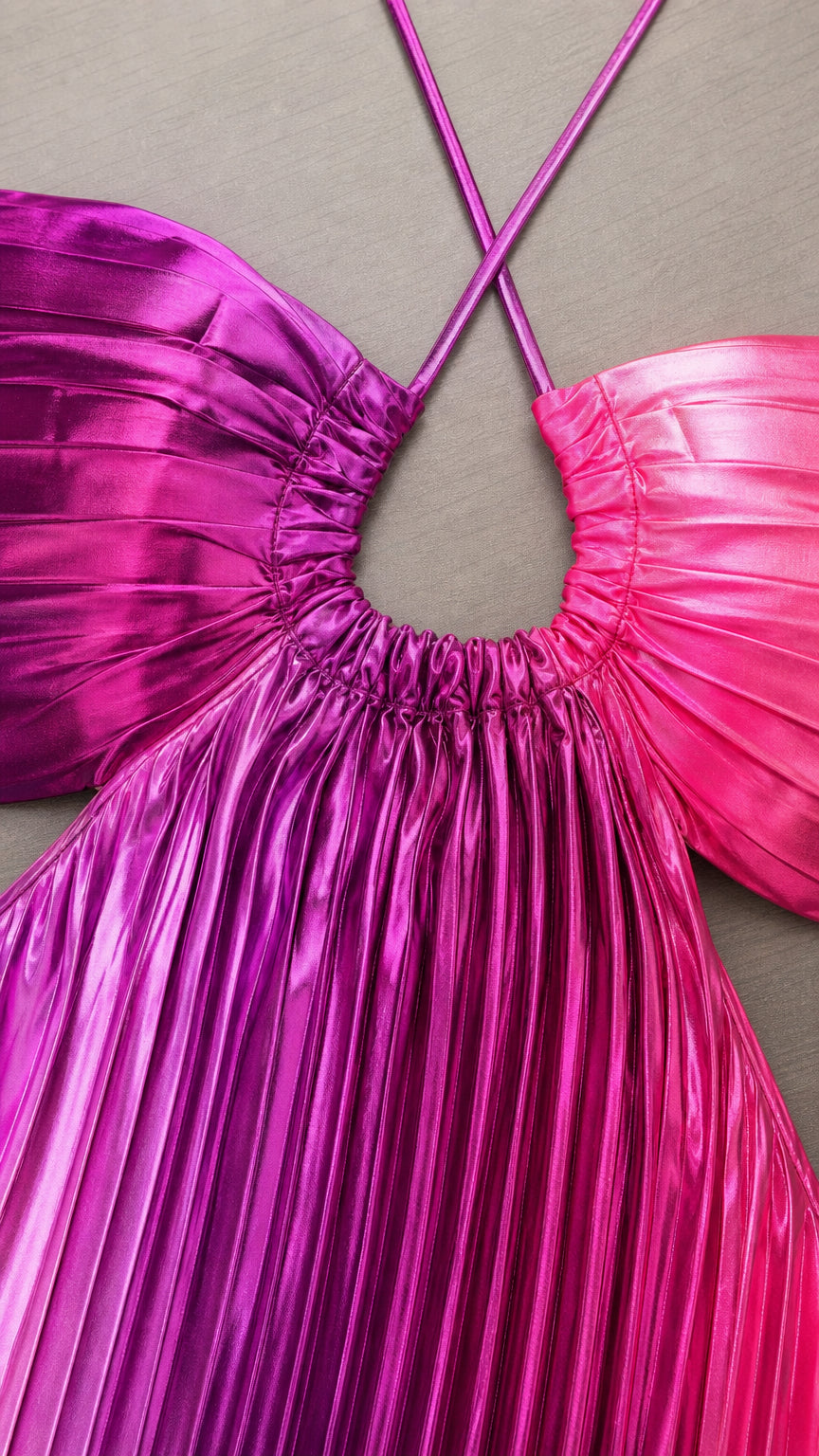 Close-up detail of the halter neckline, gathering, and metallic pleating
