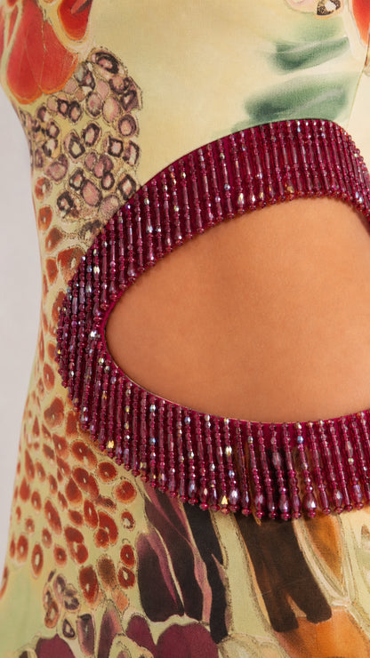 Close-up of beaded fringe trim along the waist cutout