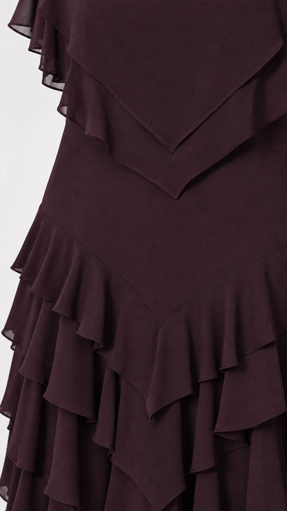 Close-up detail of layered ruffles on burgundy dress