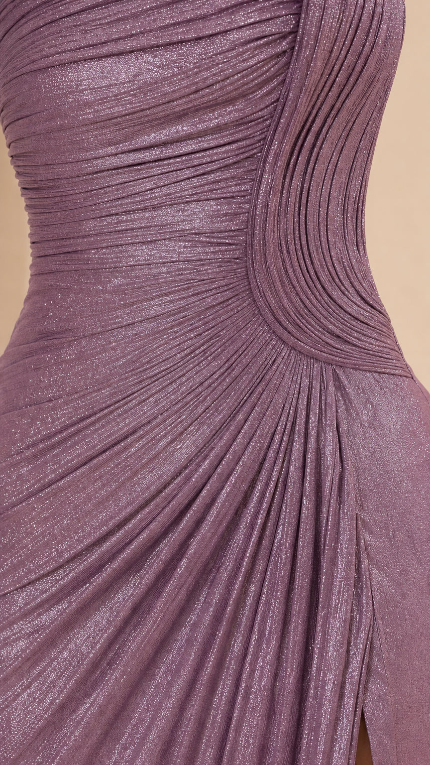 Close-up detail of mauve shimmer fabric texture and sculptural pleated design