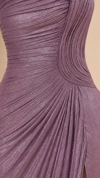 Close-up detail of mauve shimmer fabric texture and sculptural pleated design