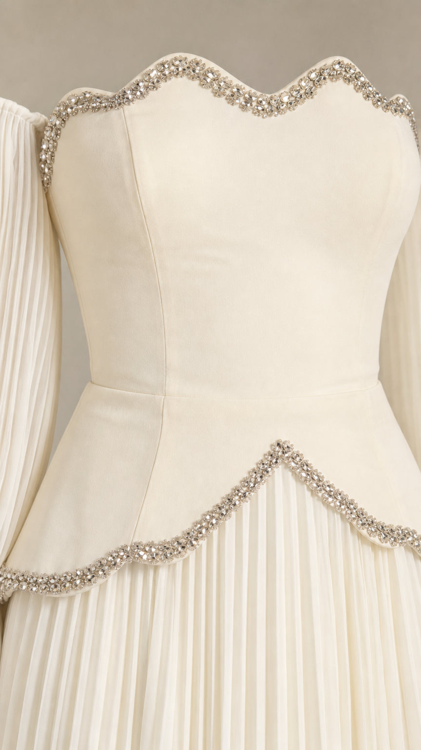 Close-up detail of crystal beaded scalloped sweetheart neckline and waist trim on ivory gown