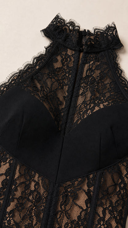 Close up detail of black halter neckline and floral lace corset bodice