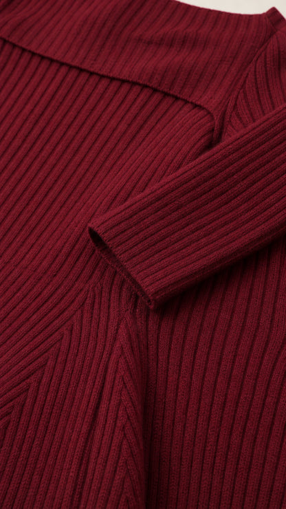 Closeup detail of textured ribbed knit fabric and sleeve cuff
