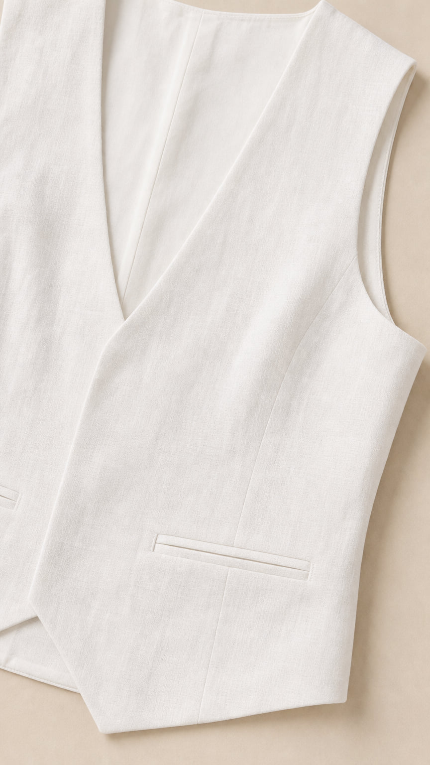 Close-up detail of white tailored V-neck vest with pocket detail