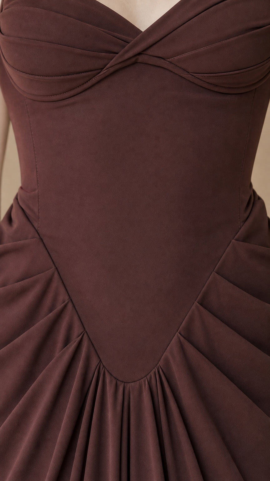 Close-up detail of sweetheart neckline and gathered basque waist stitching on chocolate brown gown