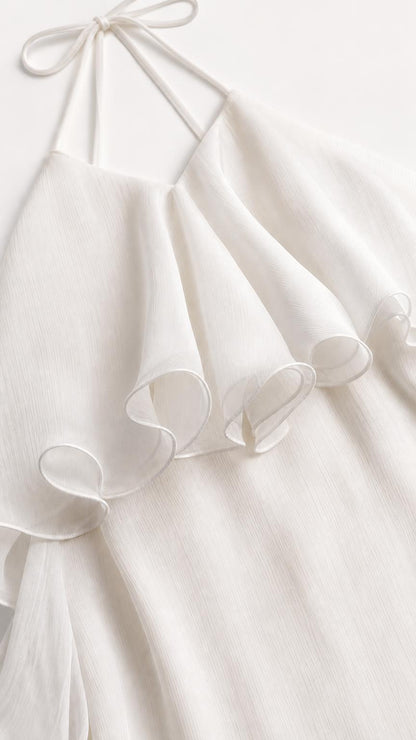 Close up of White dress halter tie and ruffle detail