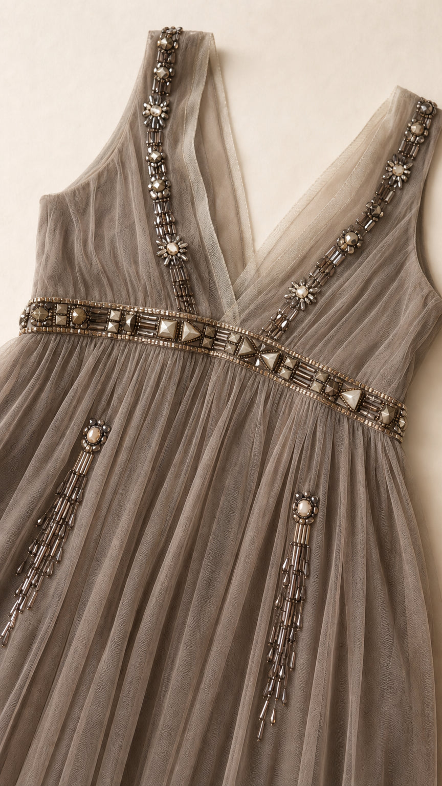Close-up detail of rhinestone and bead embroidery on bodice