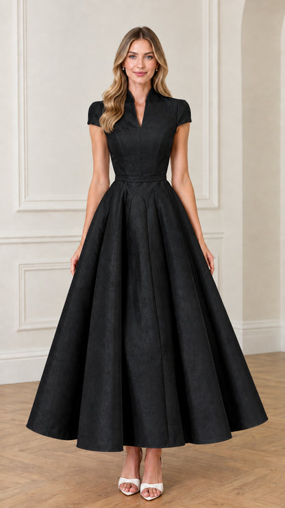 Front view of woman wearing Black cap sleeve split neck flare maxi dress