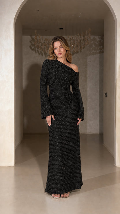 Model wearing Black one-shoulder long sleeve textured evening maxi dress
