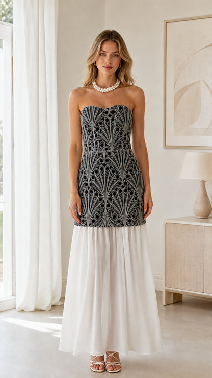 Front view of black embroidered bodice with white skirt strapless maxi dress