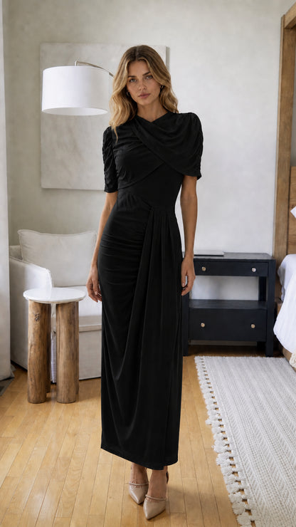 Front view of model wearing Black draped maxi dress