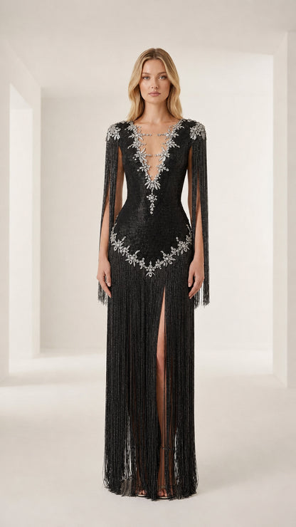Front view of model wearing a black crystal-embellished fringe evening gown
