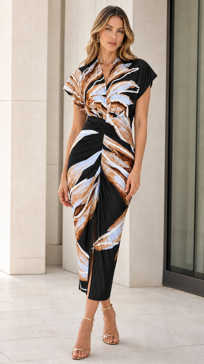 Woman wearing black abstract print midi dress