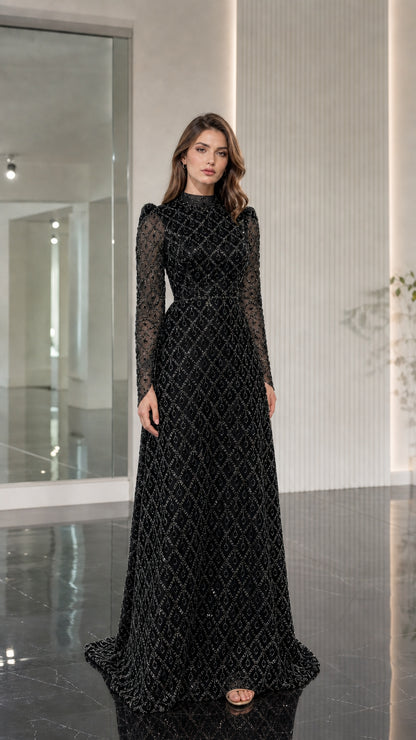 Model wearing black geometric beaded long sleeve high neck evening gown