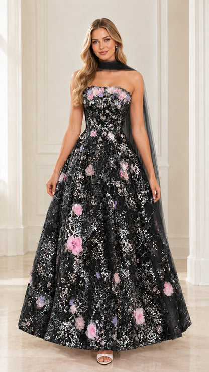 Front view of model wearing black strapless 3D floral sequin gown with matching black scarf