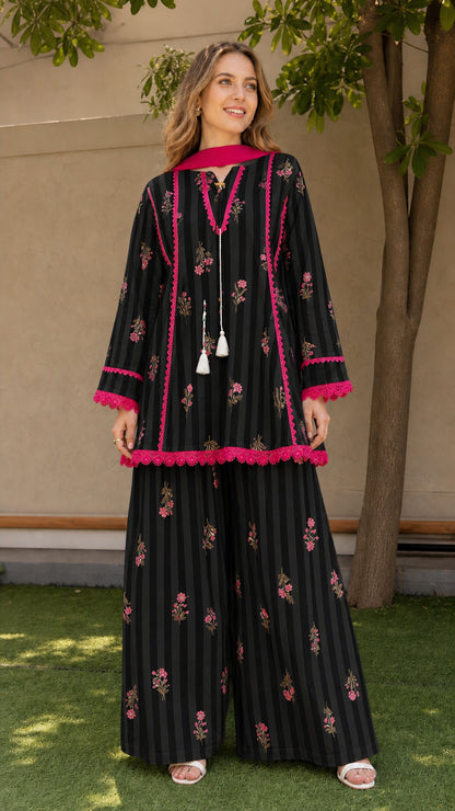 Woman wearing black variant of striped floral kurti and palazzo set