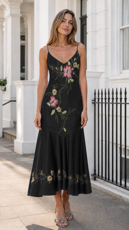 Front view of black satin slip midi dress with floral embroidery
