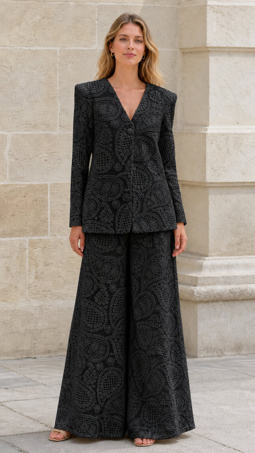 Front view of black textured blazer and wide-leg pants set