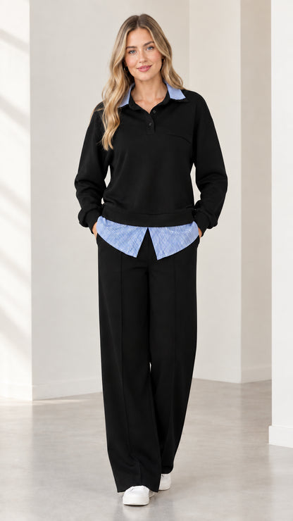 Full-body view of woman wearing black 2-piece faux layered sweatshirt set