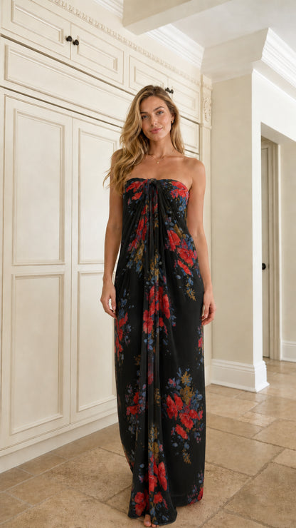 Front view of woman wearing black floral strapless maxi dress