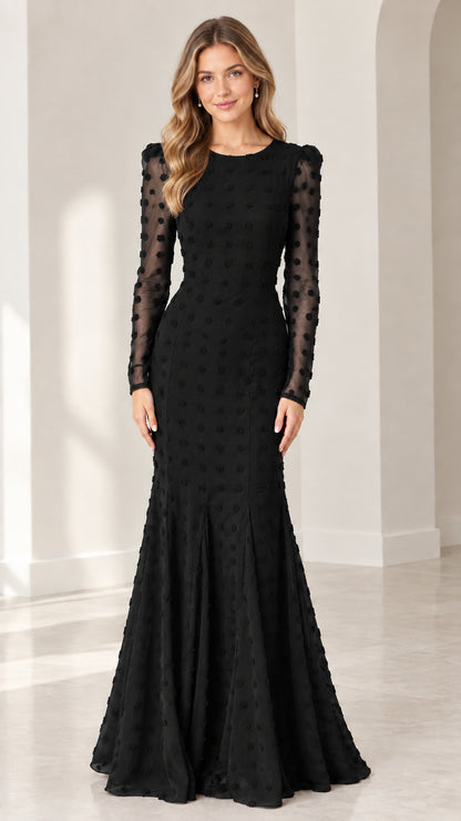 Full front view of model wearing black long sleeve swiss dot mermaid evening gown