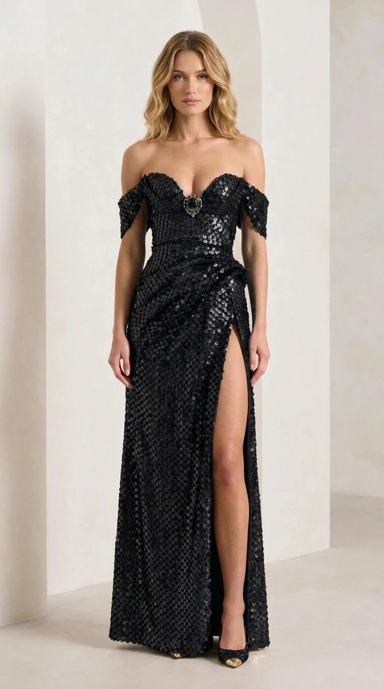 Front view of model wearing black sequin evening gown