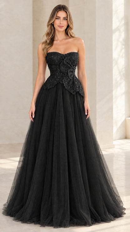 Model wearing black strapless beaded tulle evening gown