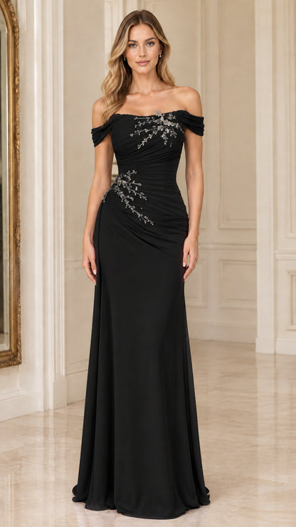 Woman wearing a black off-the-shoulder beaded ruched formal evening gown