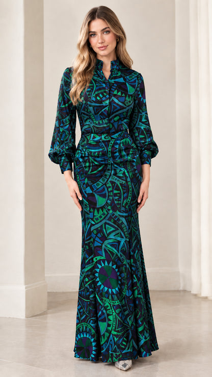 Model wearing dark teal geometric print long sleeve mermaid maxi dress
