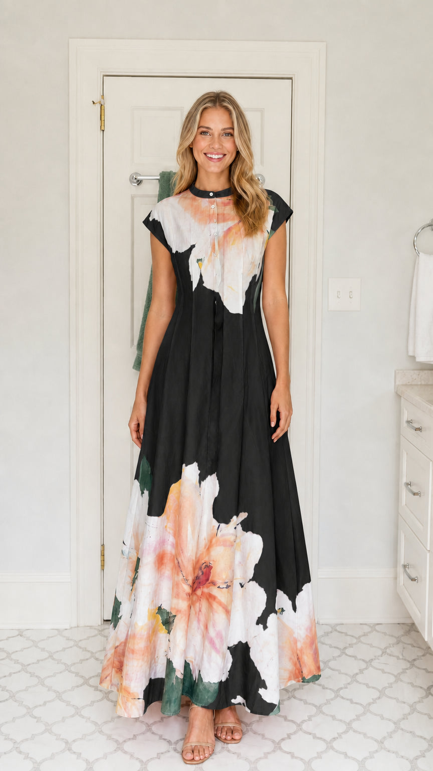 Front view of woman wearing black watercolor floral mandarin collar maxi dress