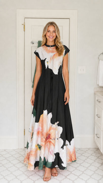 Front view of woman wearing black watercolor floral mandarin collar maxi dress